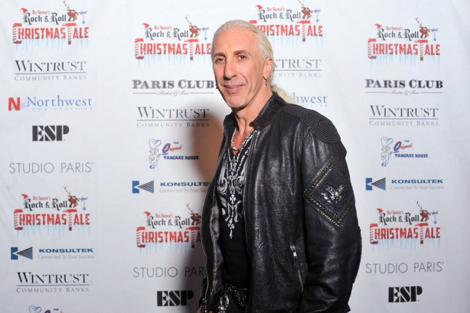 rock legend Dee snider poses on the step and repeat at the after party for his rock n roll christmas tale, studio paris, chicago