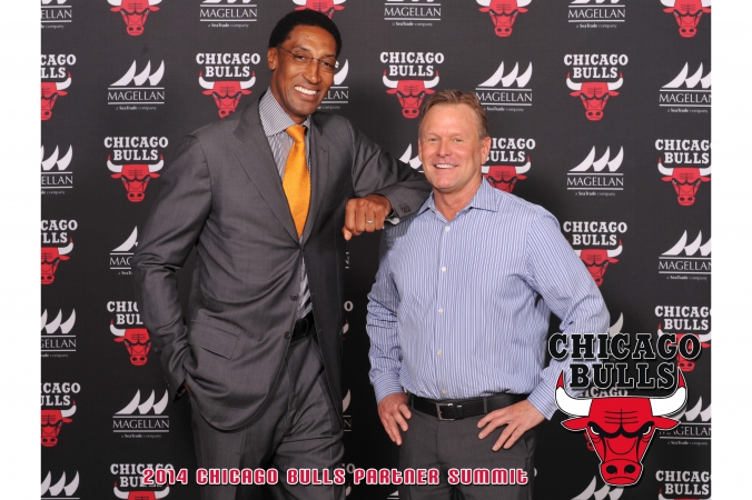 chicago bulls nba legend scottie pippen poses on step repeat with a fan who gets 8x10 photo souvenir printed instantly onsite