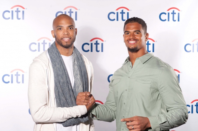 sports celebrities taj gibson and corey wootton pose on step and repeat at private corporate event downtown chicago, photography by fab photo