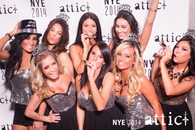 beautiful hostesses pose on step and repeat for party photography at attic nightclub downtown chicago, new years eve