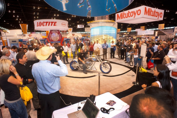 Faro increases its tradeshow booth traffic with celebrity appearance of Paul Jr from Oragne County Choppers, photos printed onsite, quality expo, mccormick place